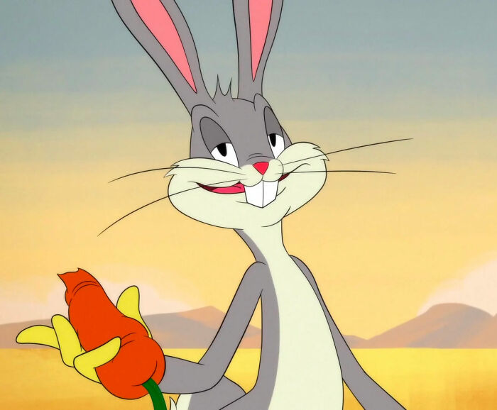 Bugs Bunny looking and holding carrot from Looney Tunes