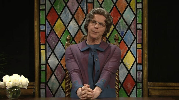 The Church Lady sitting and talking from SNL