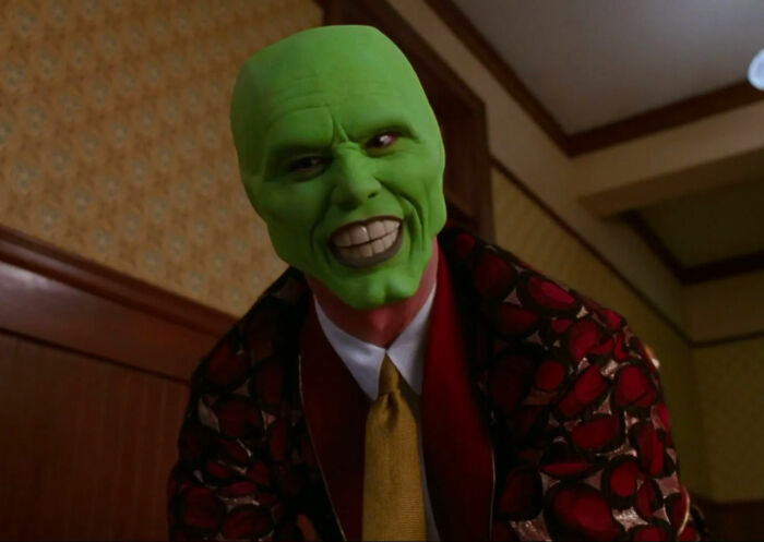 The Mask looking and smiling from The Mask