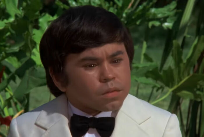 Tattoo wearing white suit and looking from Fantasy Island