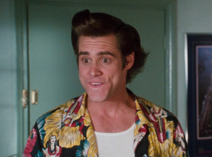 Jim Carrey looking and smiling from Ace Ventura: Pet Detective