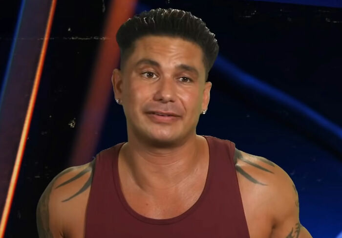 Pauly D wearing red shirt talking from Jersey Shore