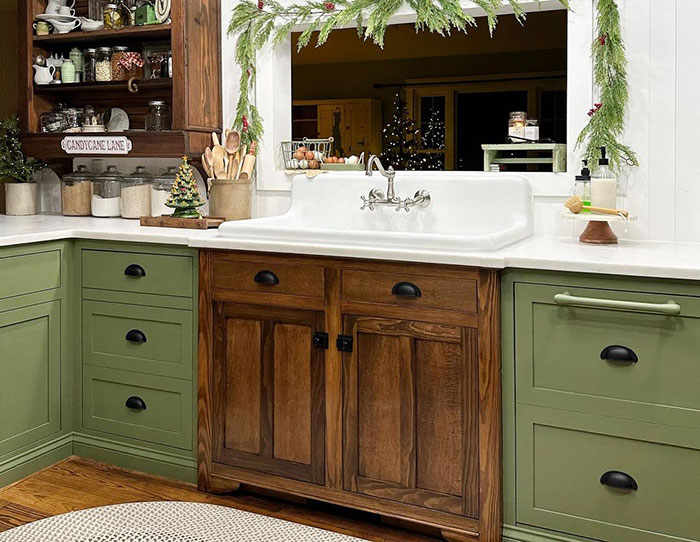 Green kitchen with light green and brown cabinets