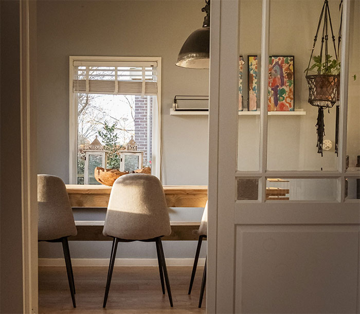 Room with chairs and wooden table Room with chairs and wooden table