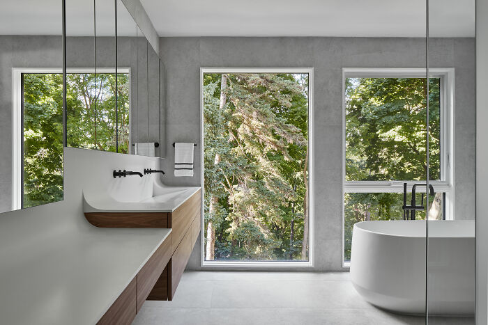 White bathroom with white sink and big windows