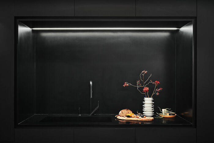 Black kitchen with decorations