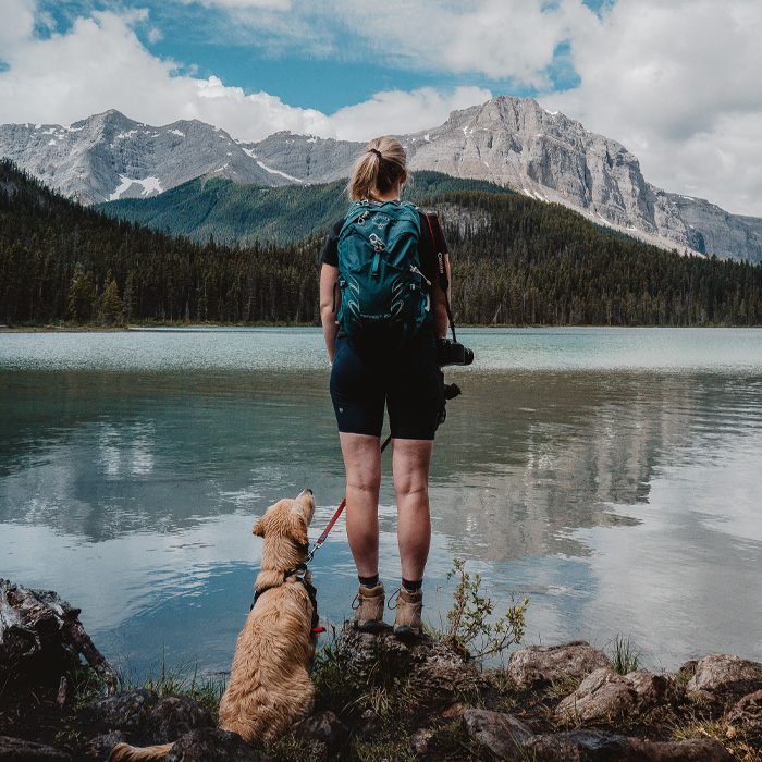Woman hiking with her dog 