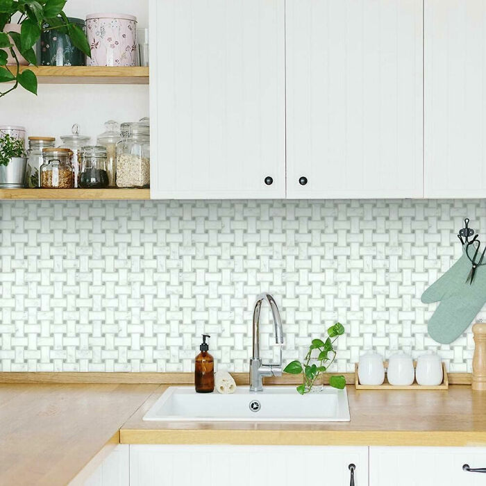 Kitchen with basketweave peel wallpaper and wooden countertop