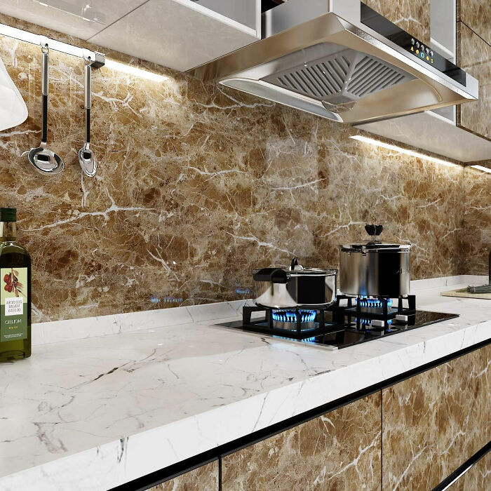 Kitchen with granite looking wallpaper and white countertop