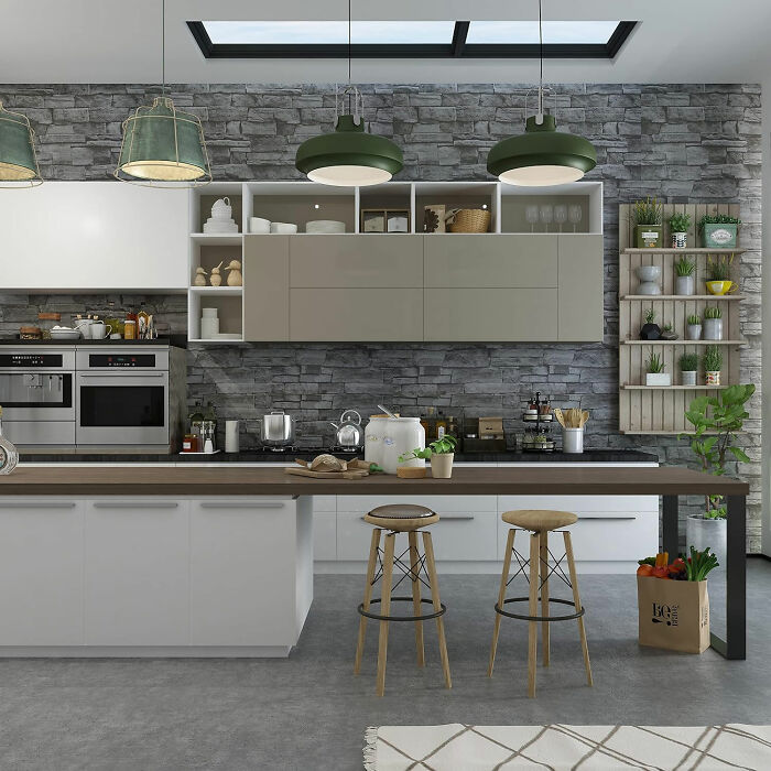 Kitchen with natural stone wallpaper and white cupboards