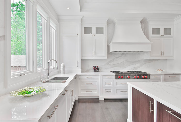 White kitchen with white marble countertops