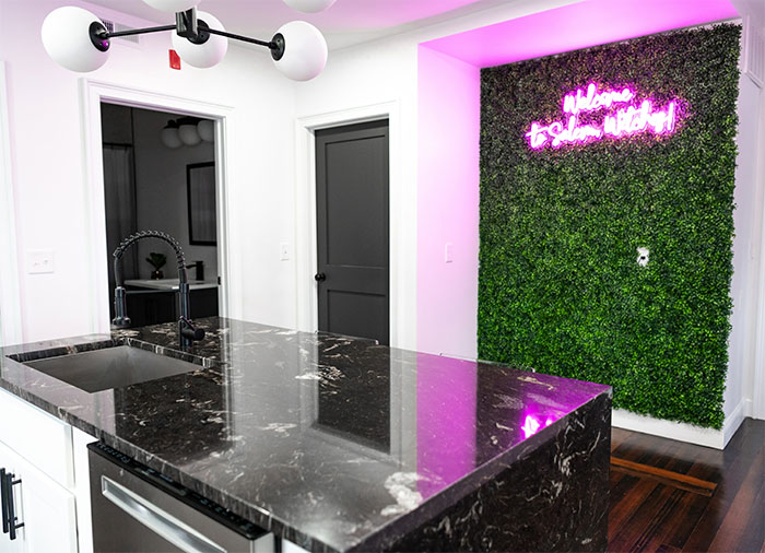 Kitchen with black calacatta marble countertop in a white kitchen Kitchen with black calacatta marble countertop in a white kitchen