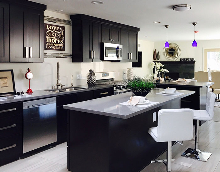 Black kitchen with white marble countertop Black kitchen with white marble countertop