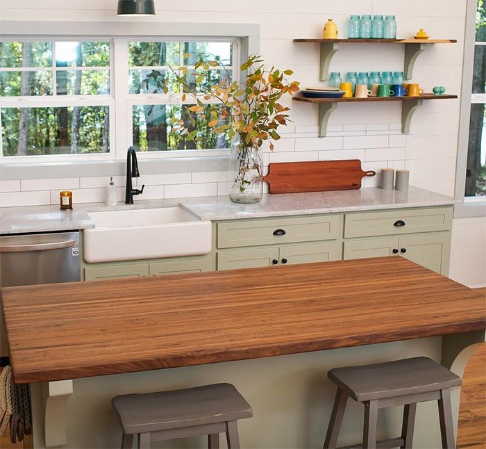Kitchen with butcher block and marble countertops