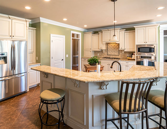 Kitchen with Crema Marfil countertop Kitchen with Crema Marfil countertop
