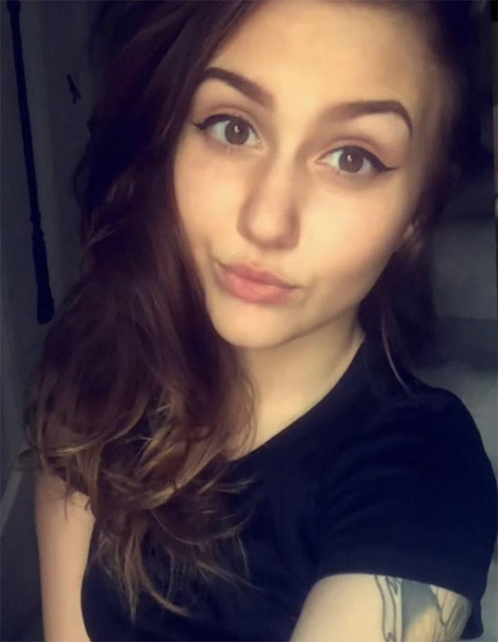 Woman with tattoos poses for a selfie, showcasing her inked look after years of body modifications. Woman with tattoos poses for a selfie, showcasing her inked look after years of body modifications.