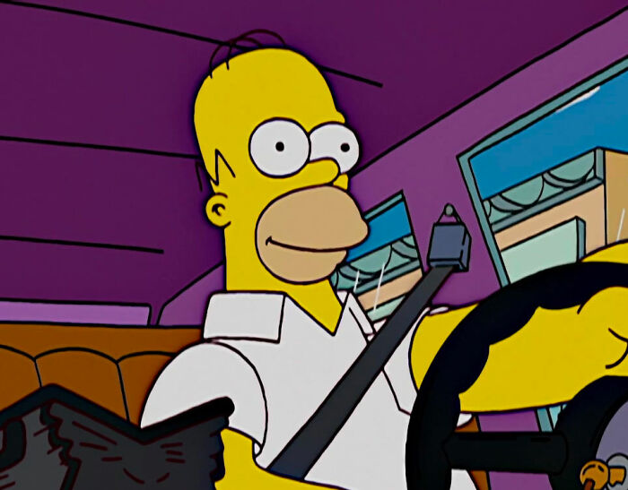 Homer Simpson driving a car