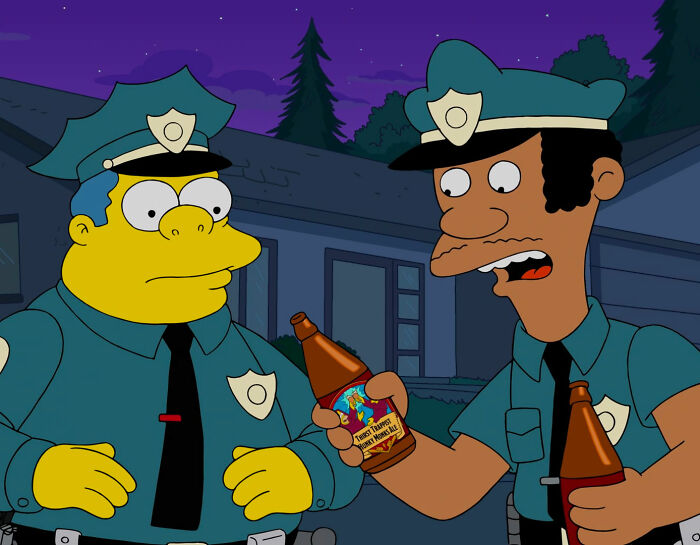 Chief Clancy Wiggum looking at beer