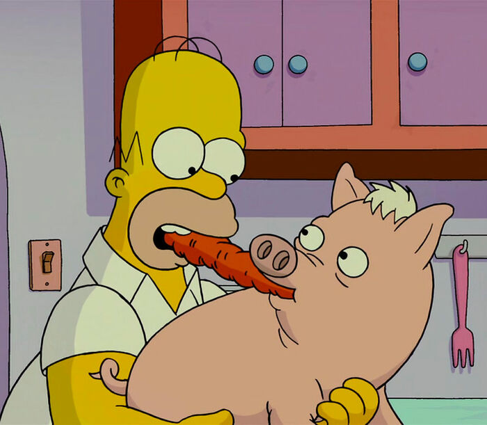 Homer eating carrot with pig