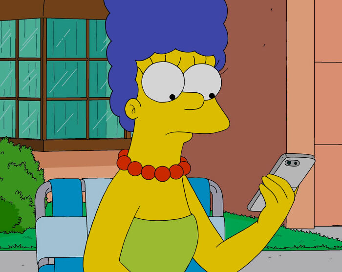 Marge looking at phone