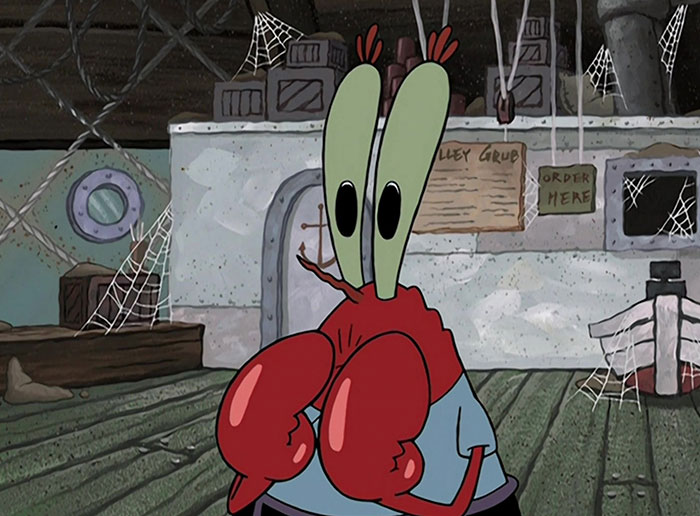 Mr. Krabs looking scared with his hands on his face 