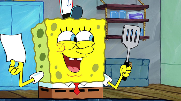 SpongeBob holding a spatula and a piece of paper 