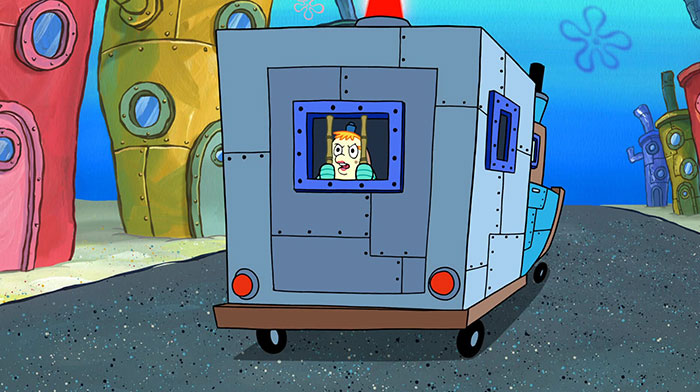 Mrs. Puff in the back of Police car 
