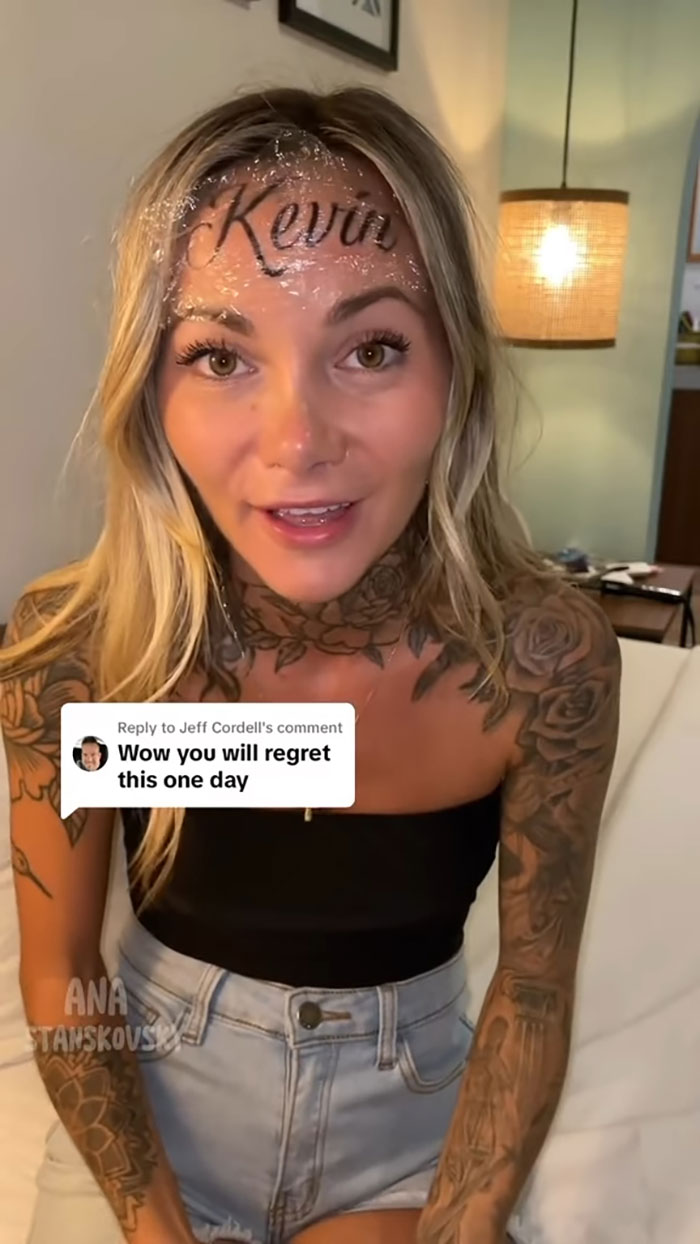 Influencer with "Kevin" ink on forehead, addressing comments about it being fake. Influencer with "Kevin" ink on forehead, addressing comments about it being fake.