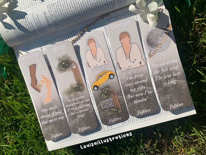 Taylor Inspired Folklore Laminated Bookmarks: The waterproof, sturdy gift for devoted Swifties and book lovers, complete with free stickers for extra Swift-astic flair.