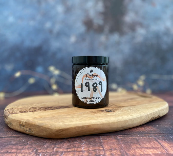 Taylor Swift Soy Wax Candle: A perfect gift for Swiftie friends, that kindles with wildflower, pine, and woods aroma in a hand-poured, vegan soy wax setting.