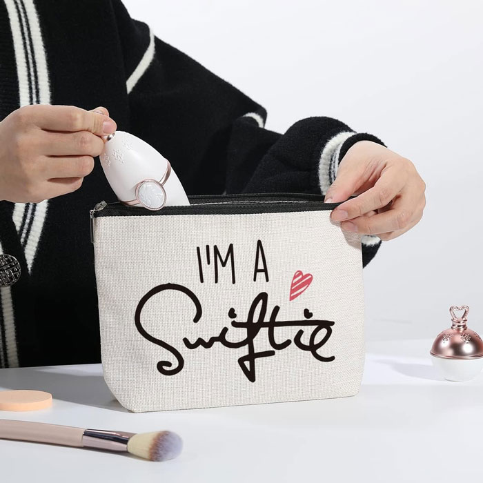 Taylor Swift's Fans Makeup Bag: A compact and cute, perfect for showing off Swiftie pride while carrying all vital cosmetics on-the-go, making it an ideal gift for any special occasion or just as a treat for yourself!