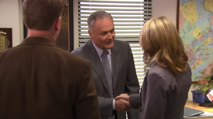 Creed Bratton talking and pressing hand