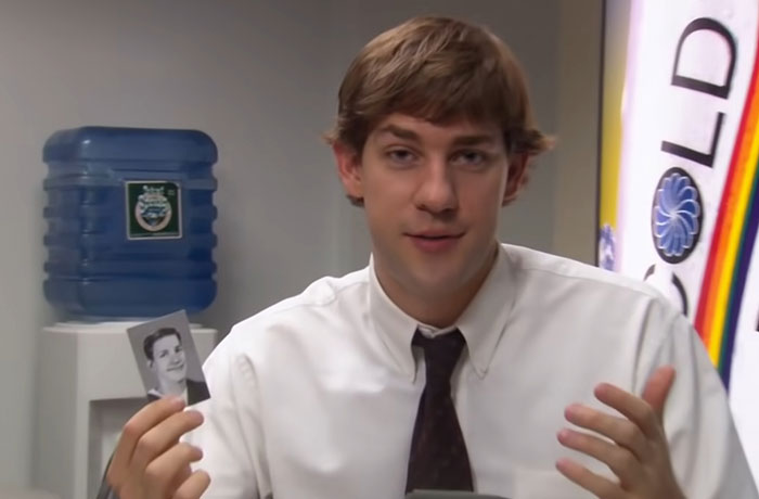 Jim Halpert talking while holding his picture 