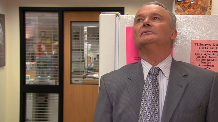 Creed Bratton looking up while talking 