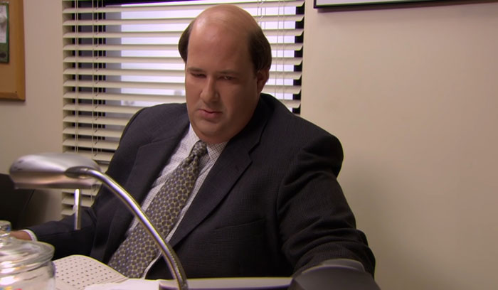 Kevin Malone sitting at the office 