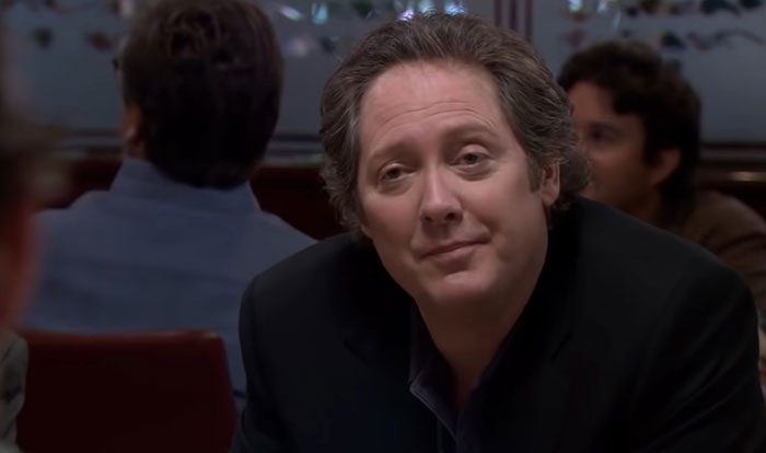 Robert California looking at someone and talking 