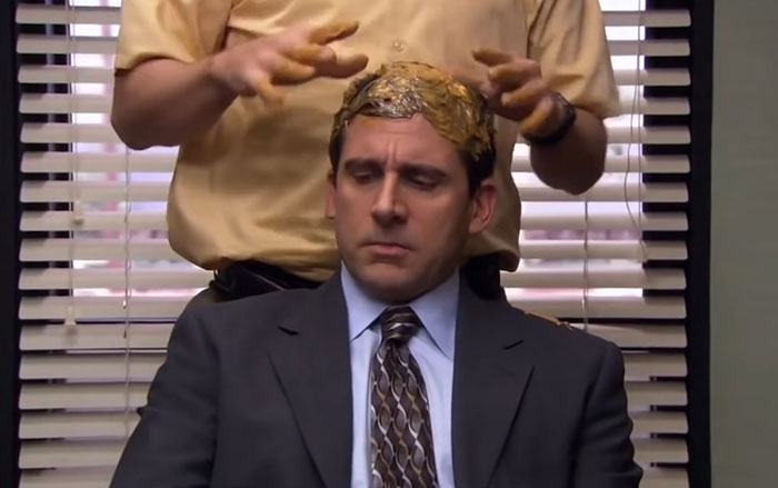 Michael Scott with peanut butter being massaged in his hair 