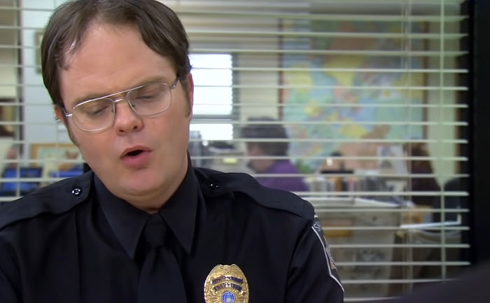 Dwight Schrute talking while in an officers outfit 
