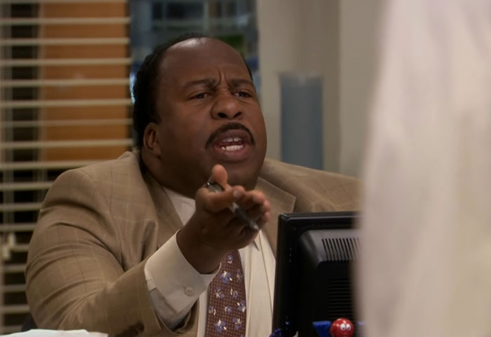 Stanley Hudson talking and gesticulating 
