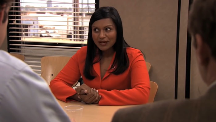 Kelly Kapoor talking with her hands crossed 