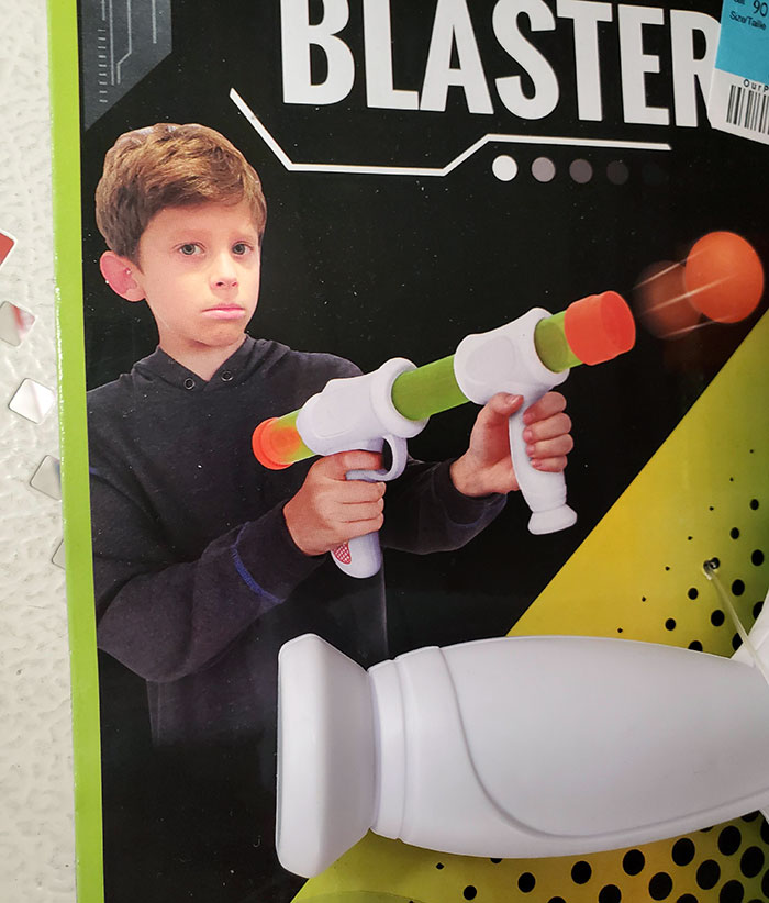 The Kid On The Packaging For This Toy Doesn't Even Seem To Enjoy Playing With It