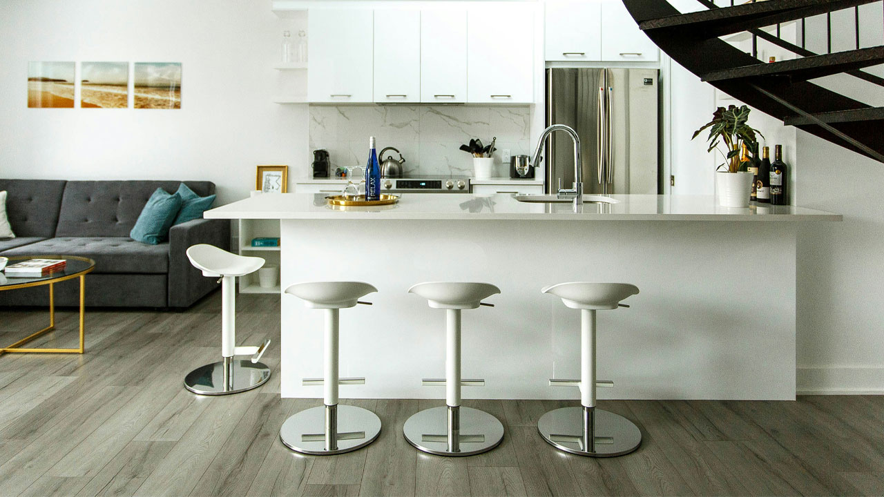 Image of modern and minimalistic kitchen with white cabinets.