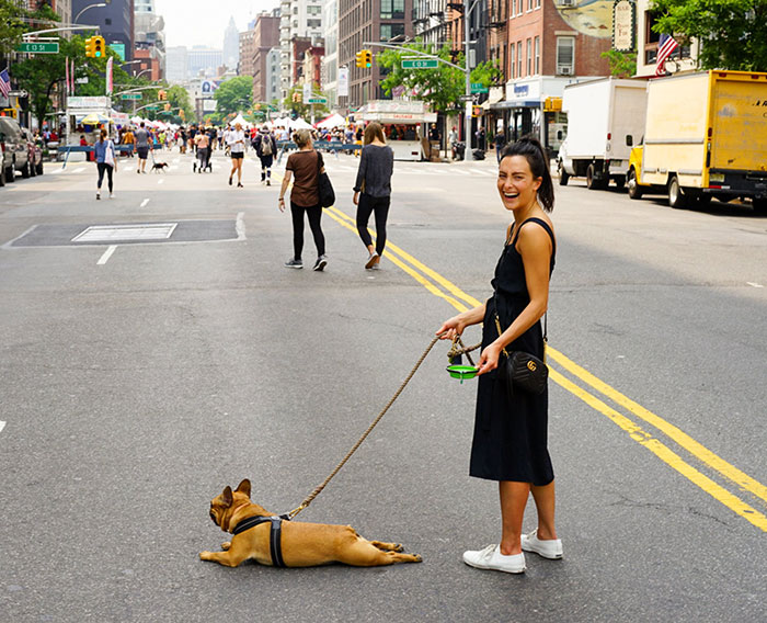 Woman With Dog at the Middle of the Street
