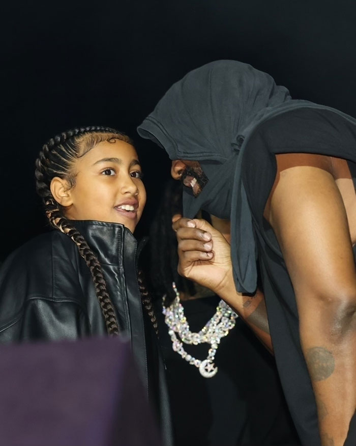 “Get Her Off The Stage”: Ku Klux Klan Hood Worn By Kanye West Next To Daughter North Sparks Outrage