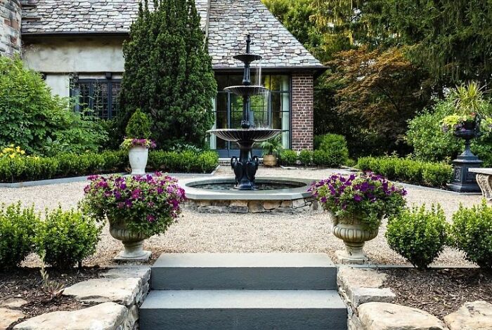Fancy backyard with a Fountain as a focal point 