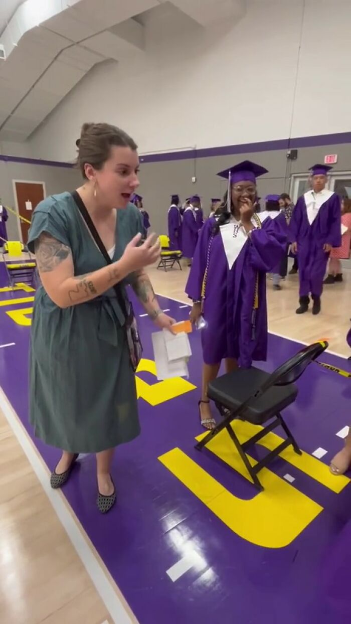 Teacher and student share an emotional moment at graduation, celebrating meaningful handwritten notes. Teacher and student share an emotional moment at graduation, celebrating meaningful handwritten notes.