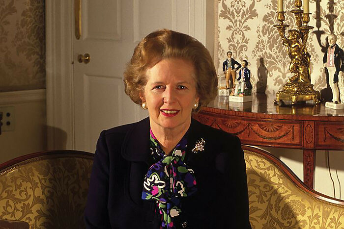 Margaret Thatcher posing for a picture 