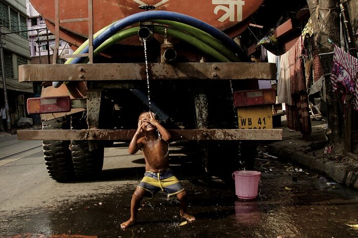 Street Photography, Honorable Mention: Summer Bath By Debasish Ghosh