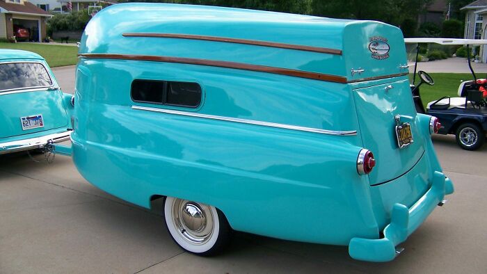 This Is A 1954 Camper With A Boat As Its Top
