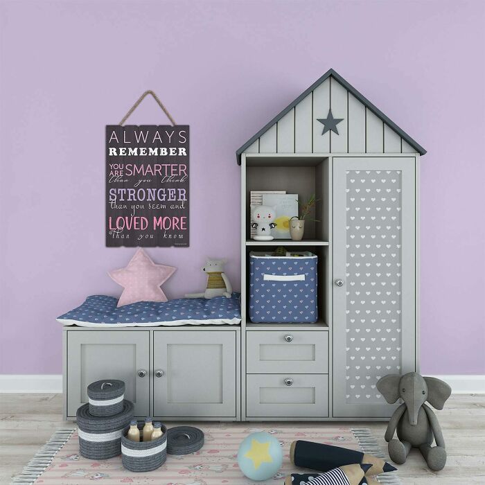 Room with purple walls, gray closet, and black wall sign
